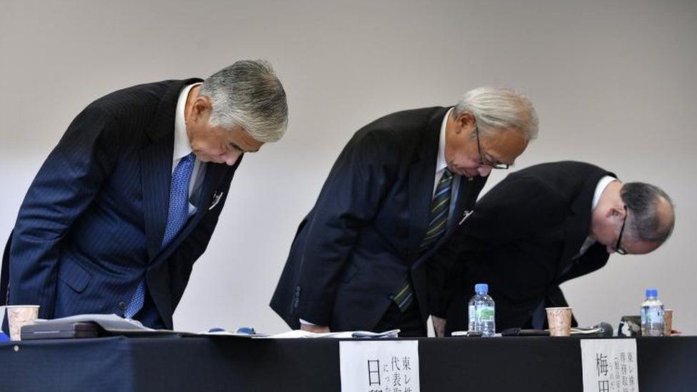 Toray Industries President Akihiro Nikkaku (L), Executive Vice President Akira Umeda (C) and Toray Hybrid Cord, Inc. President Nobuhiro Suzuki (R) bow at the end of a press conference in Tokyo