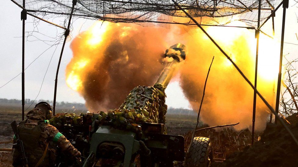 A Ukrainian soldier fires an artillery shell. File photo