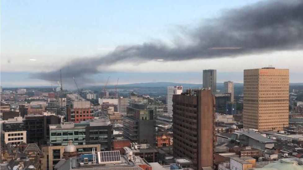 smoke plume above Salford and Manchester