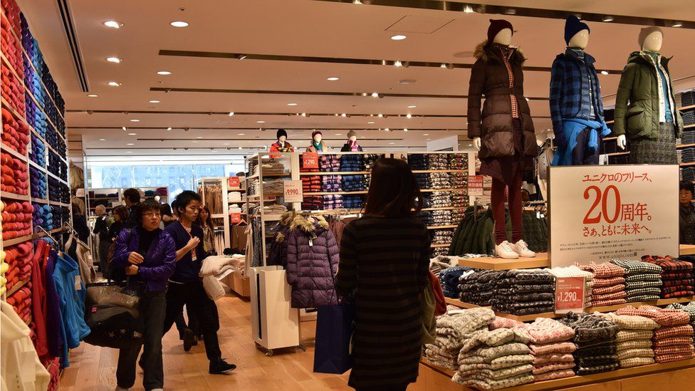 Shoppers in a Uniqlo store in Ginza district of Tokyo, Japan.