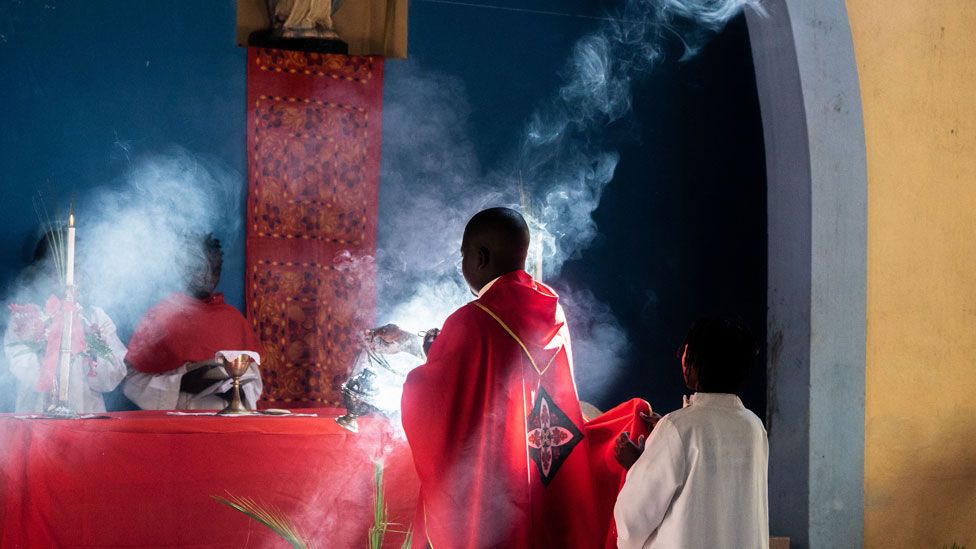 Priest burning incense at a church - Sunday 14 April 2019