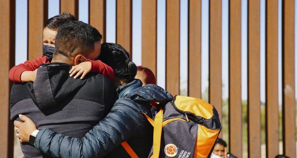 Family hugs at the US-Mexico border. File photo