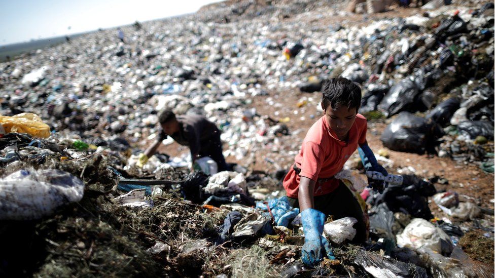 A child works at Lixao da Estrutural, Latin America's largest rubbish dump, in Brasilia, Brazil, 19 January 2018