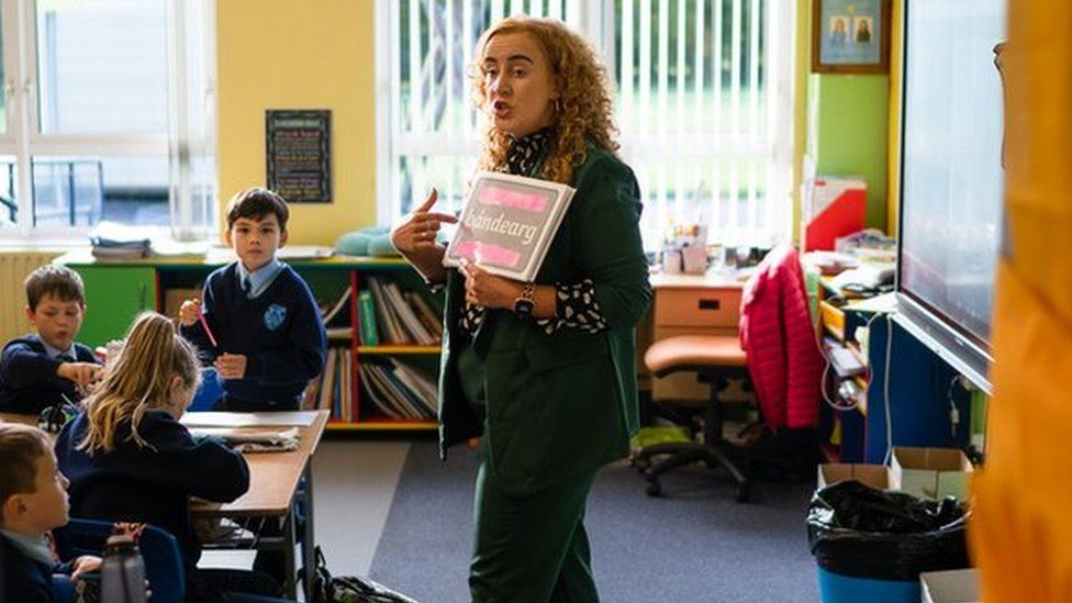 Michelle Furey teaching Irish to children in a classroom