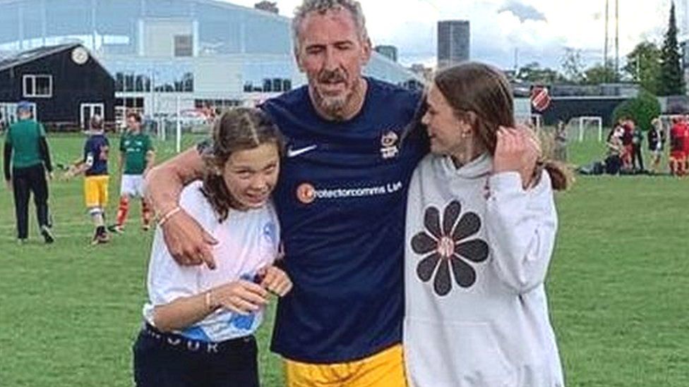 Antony Evans with his daughters