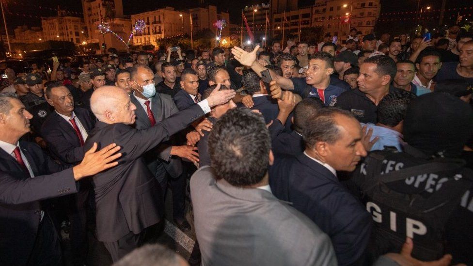 Image shows President Saied celebrating with supporters