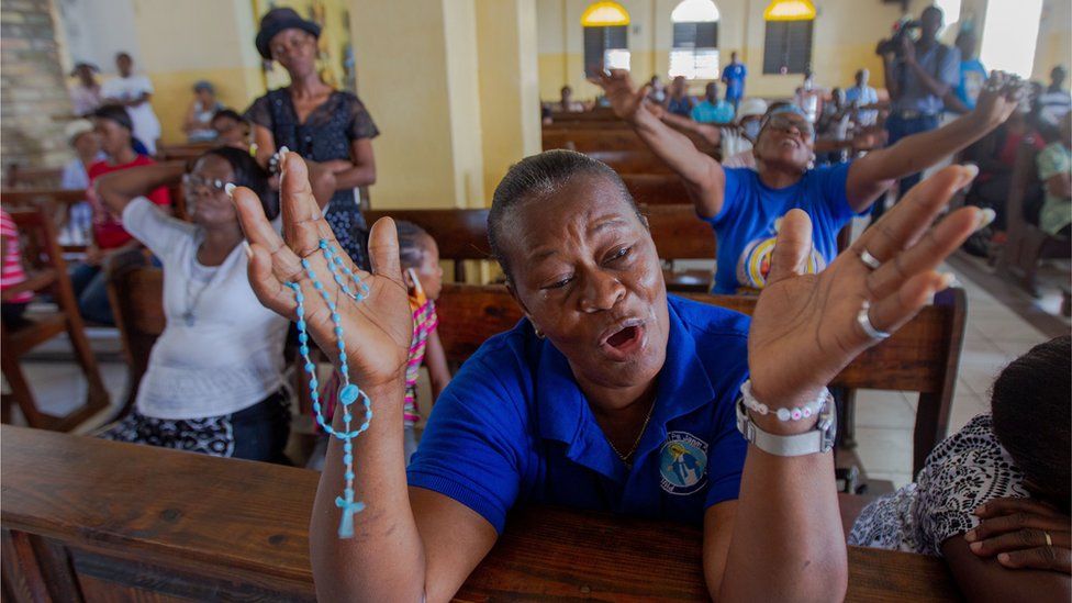 Parishioners pray in Saint Antoine Church, where Father Michel Briand, one of the religious kidnapped days ago, worked for decades, in Port-au-Prince, Haiti, on 23 April