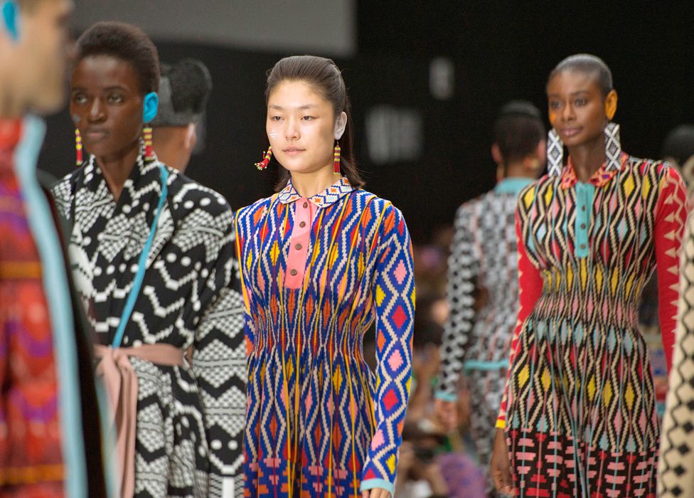 Models in MaXhosa designs on the catwalk at the Cape Town International Fashion Week - 2019