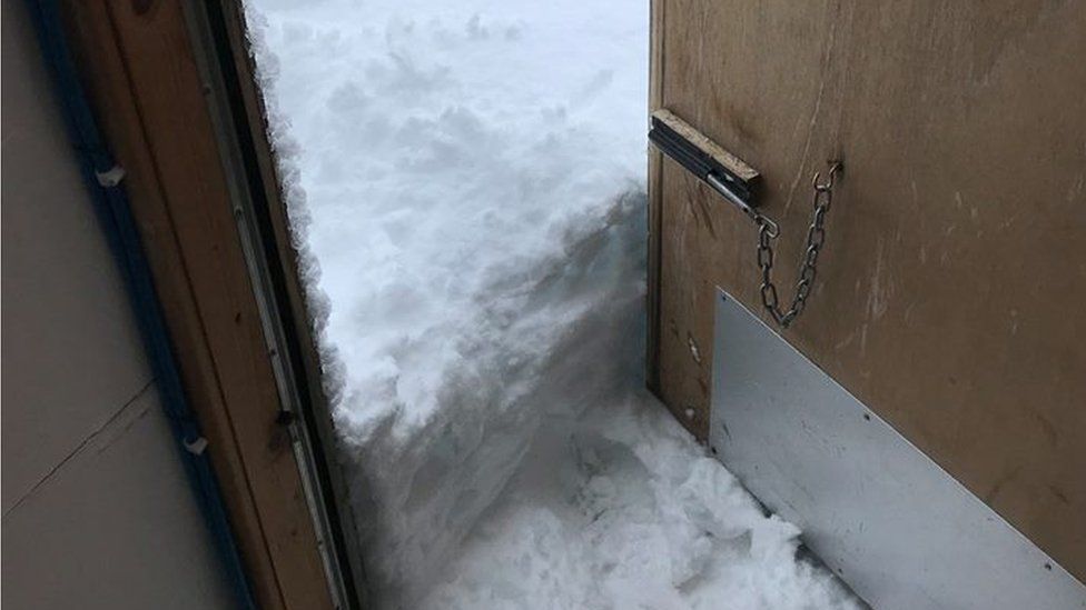 Snow at a door at Cairngorm Mountain base station