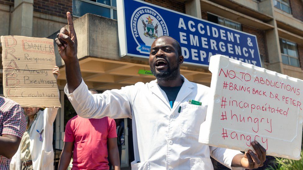 Zimbabwean doctors outside Parirenyatwa Hospital in Harare protesting about the abduction of their union leader in September 2019