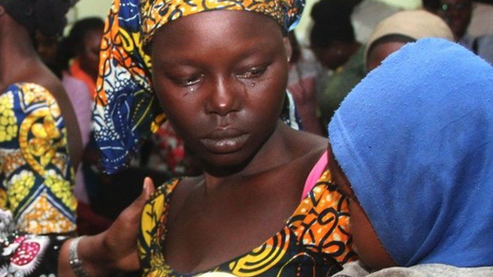 One of the 21 freed Chibok girls cries