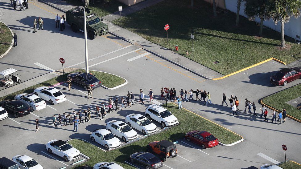 Students led from the scene of the shooting
