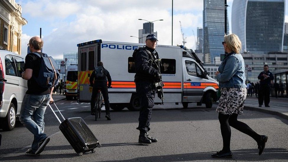 Armed police officer in central London