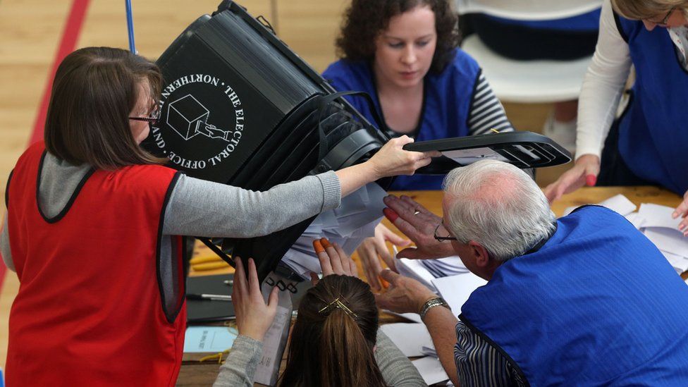 Counting staff at a centre in Londonderry begin the counting of votes