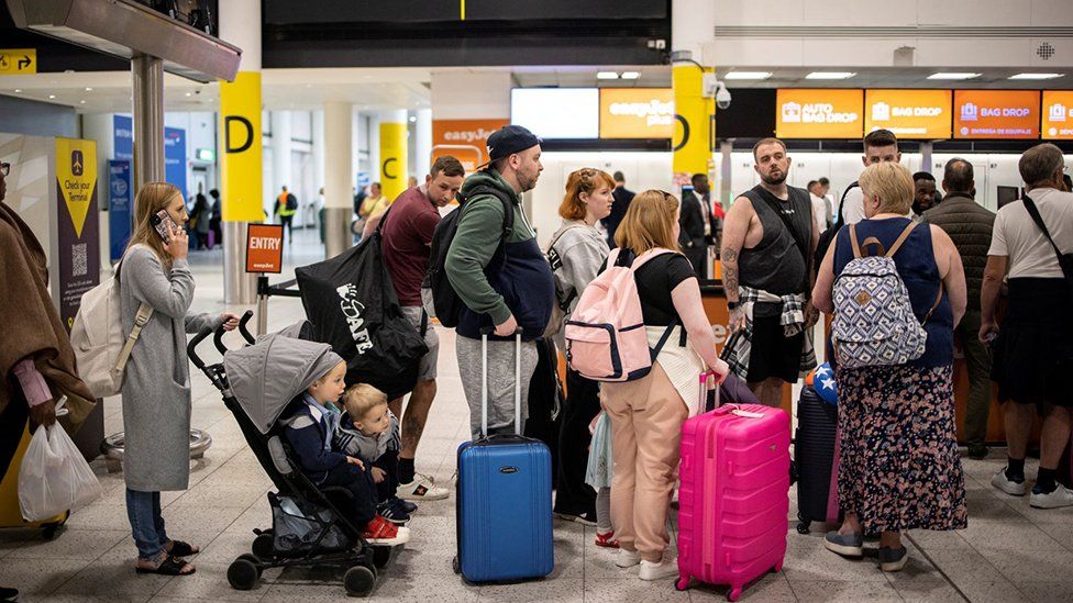 People queuing at Gatwick Airport