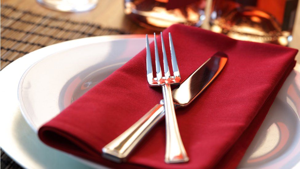 A stock photo of place setting at a dinner table