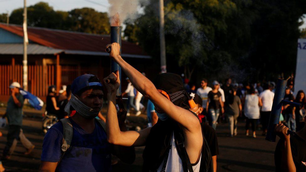 A demonstrator fires a homemade weapon during a protest against police violence and the government of Nicaraguan President Daniel Ortega in Managua, April 23, 2018