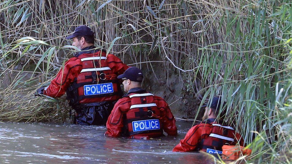 Kent Police officers from the search and marine unit scour a section of the River Stour as their search for missing six-year-old Lucas Dobson