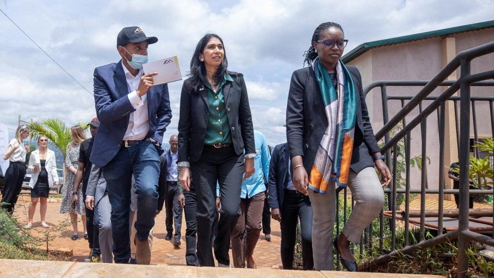Suella Braverman (centre) pictured on a visit to Rwanda last month