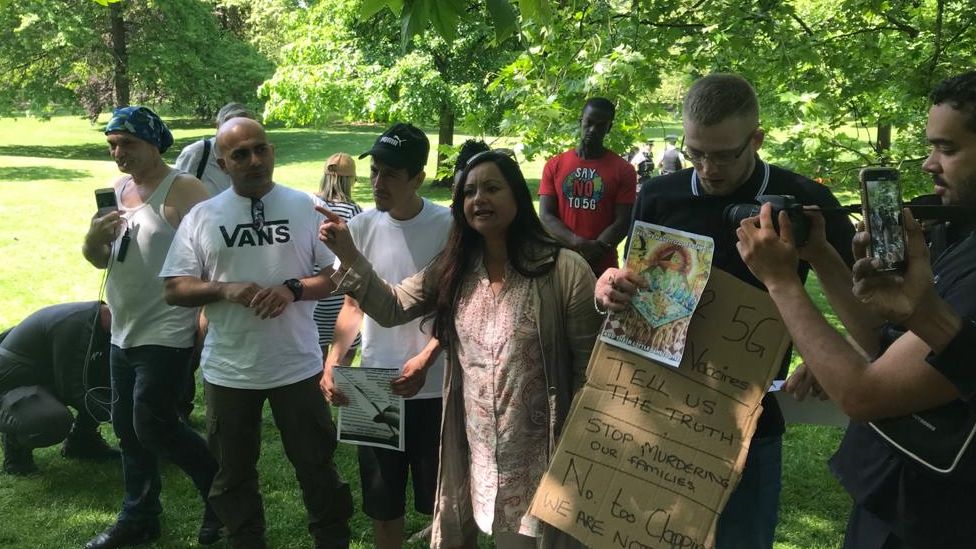 Protesters promoting conspiracies about vaccines and 5G attend a protest in St James's Park, London in May.
