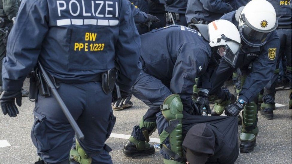 German police detaining protester