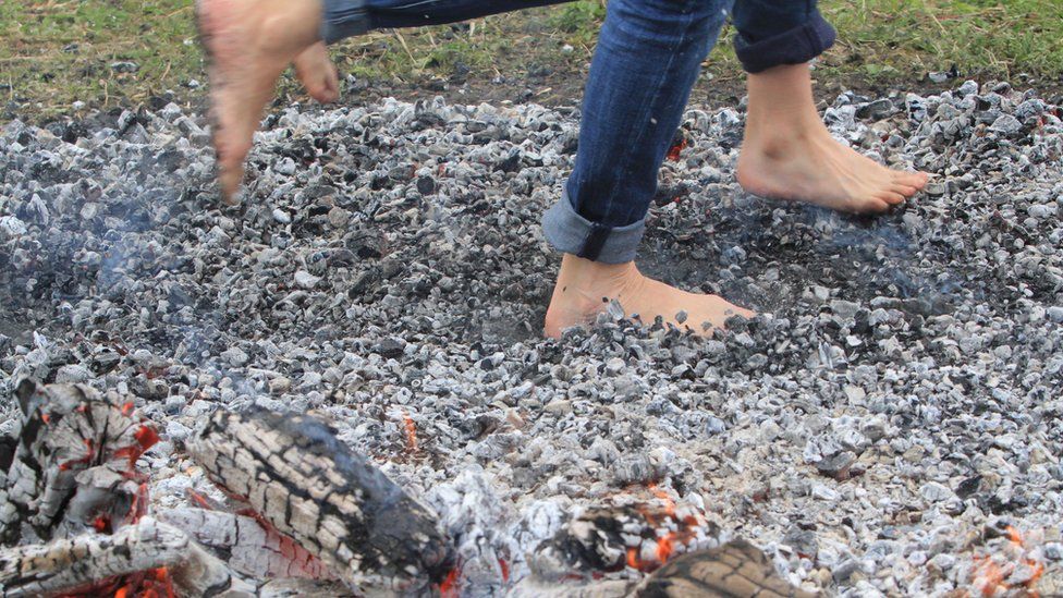 People walk on hot coals in Lithuania