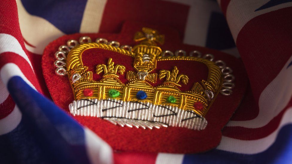 A embroidered crown a the Union flag