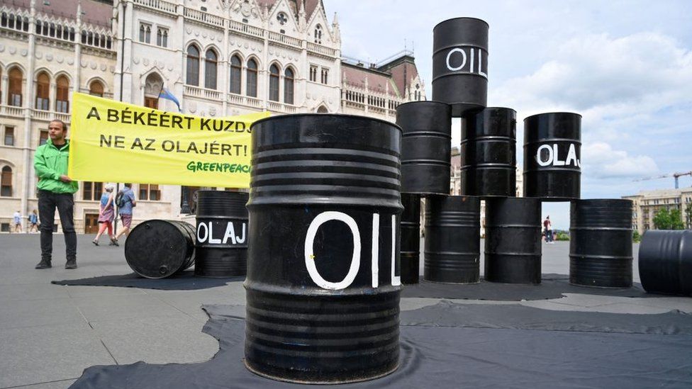 Oil barrels at a protest organised by Greenpeace in front of the Hungarian parliament in Budapest on 30 May