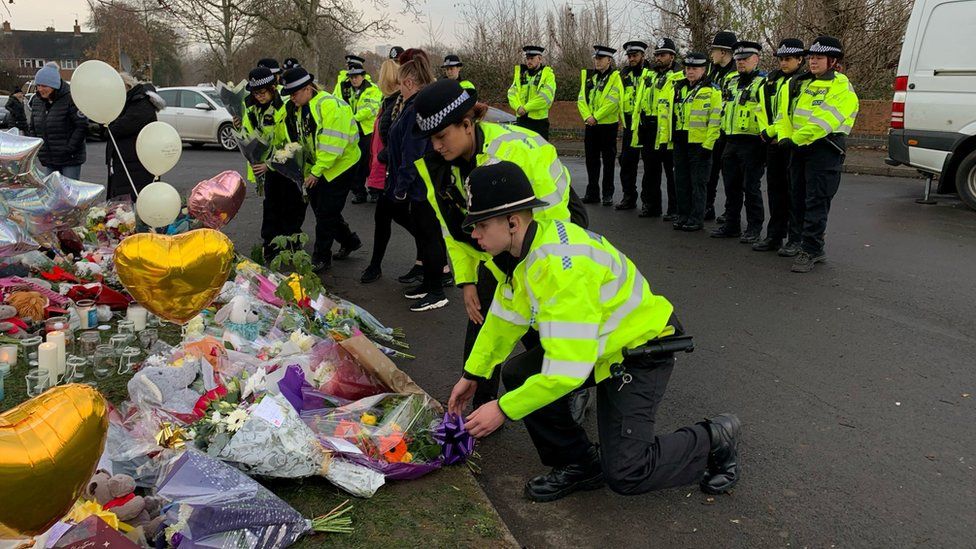 Police lay flowers