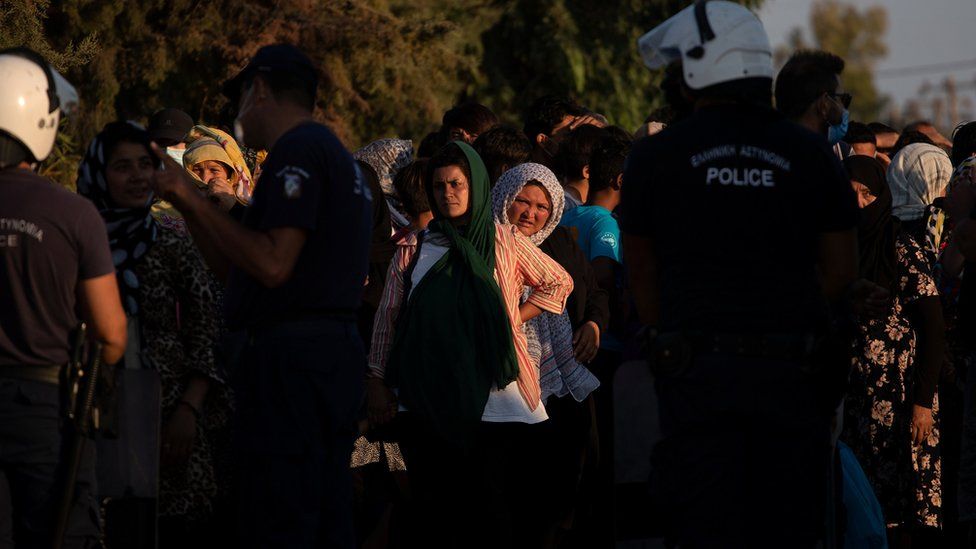 Migrants and refugees waiting to check in at temporary camp Kara Tepe