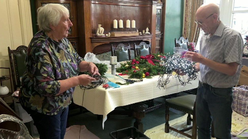 Pamela and Bob Firth prepare the decorations for their grotto