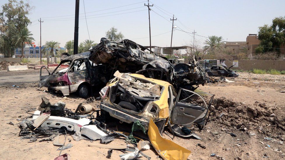 Destroyed vehicles are seen at the site of a suicide car bomber in Khalis, north of Baghdad, Iraq, July 25, 2016.