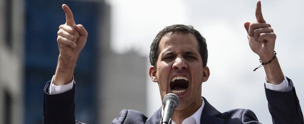 Venezuela"s National Assembly head Juan Guaidó speaks to the crowd during a mass opposition rally
