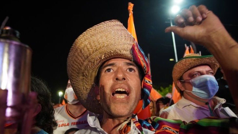 A supporter of Carlos Mesa, former president and current presidential candidate of the Citizen Community (CC) party, cheers during Mesa"s closing campaign rally ahead of October 18"s general elections, in Santa Cruz, Bolivia October 13, 2020