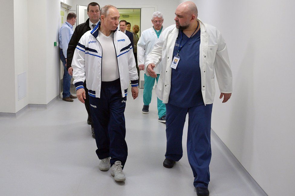 Chief physician Denis Protsenko shows round Russia's President Vladimir Putin on 24 March