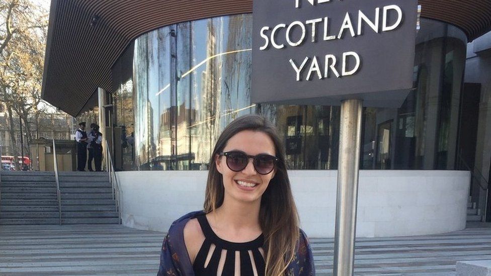 Jess McDonald, a woman with dark hair, standing outside New Scotland Yard.