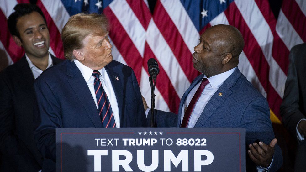 Senator Tim Scott, a Republican from South Carolina, right, and former US President Donald Trump during a New Hampshire primary election night watch party in Nashua, New Hampshire, US, on Tuesday, Jan. 23, 2024.