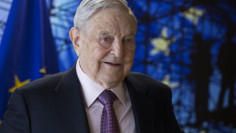 George Soros, pictured in front of EU flag in April 2017