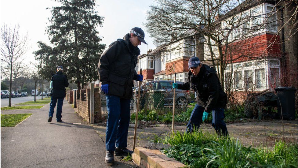 Police searching in Clapham