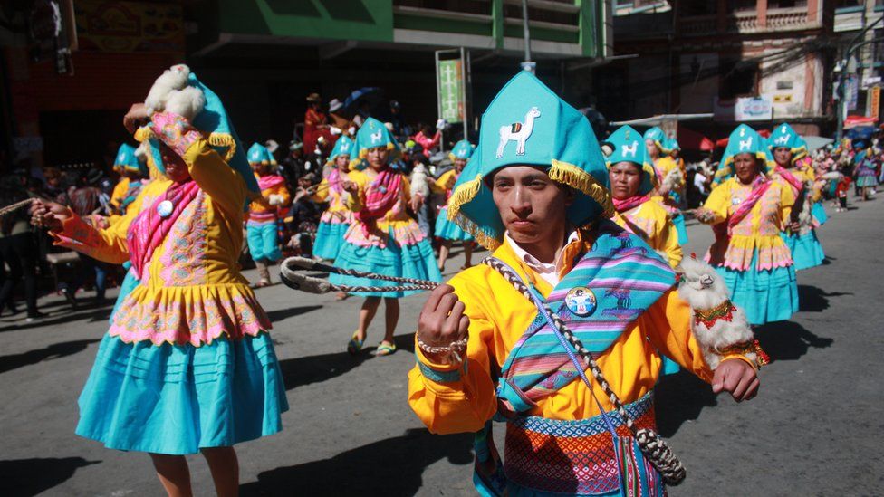 Dancers parade during the festival of Señor del Gran Poder