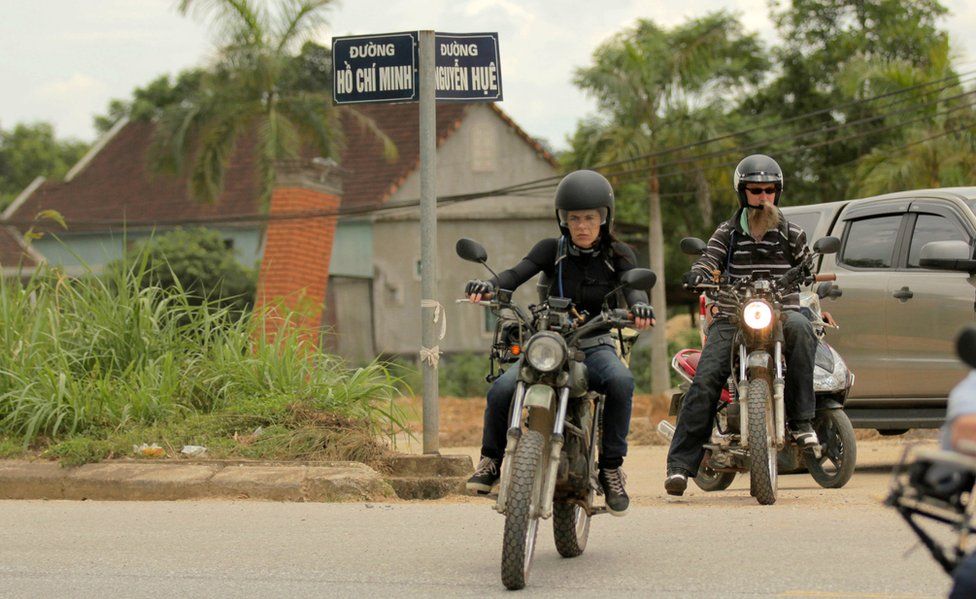 Louise Halvey and Andy Slade riding through Vietnam on motorbikes