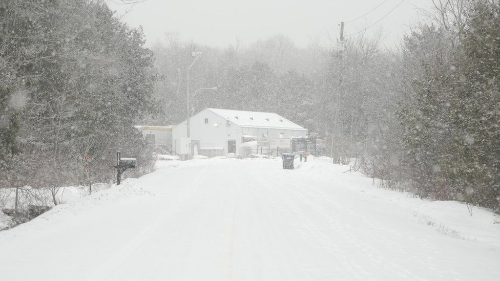 Photo of the end of Roxham Road leading to the Canadian border in the middle of a snowy February