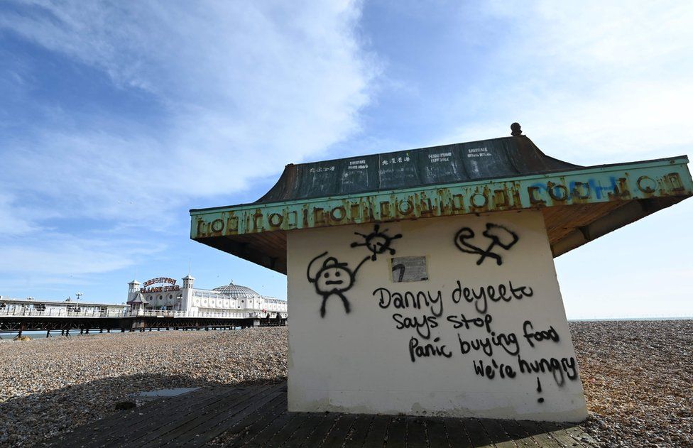 Graffiti on Brighton beach urging people to stop panic buying