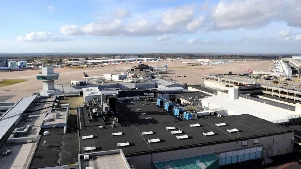 Manchester Airport: Just Stop Oil activists arrested - BBC News