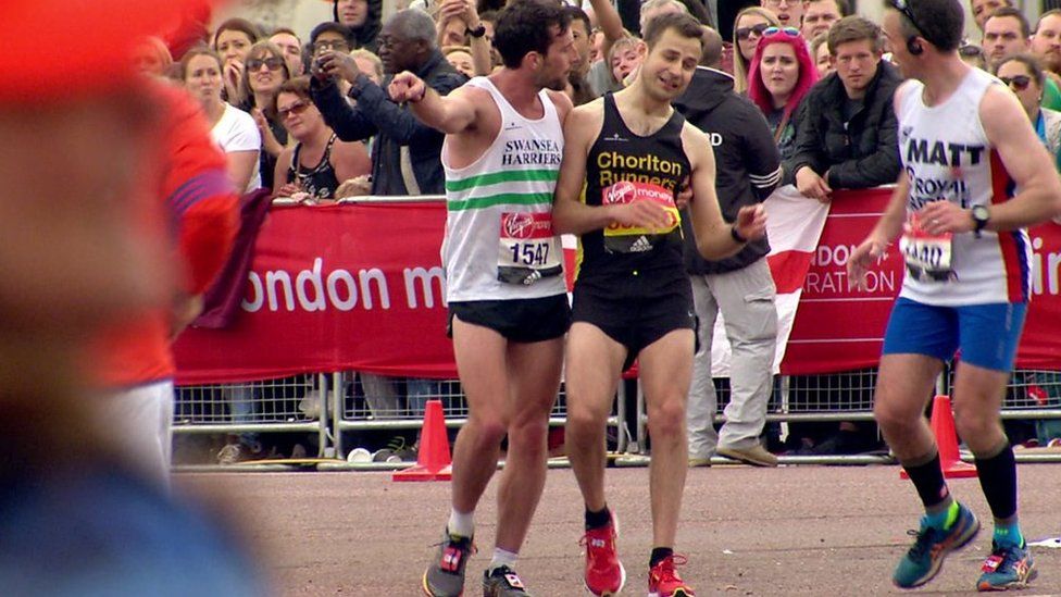 Matthew Rees helping David Wyeth to the finish line
