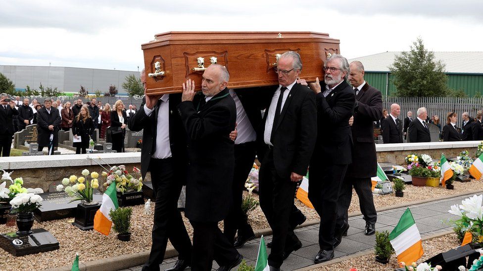 Bobby Storey's coffin being carried