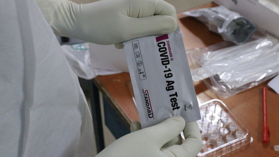 Kolkata health worker with swab test kit