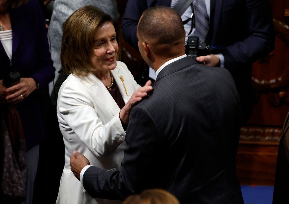 Speaker of the House Nancy Pelosi talks to Rep. Hakeem Jeffries, who will follow her into the job