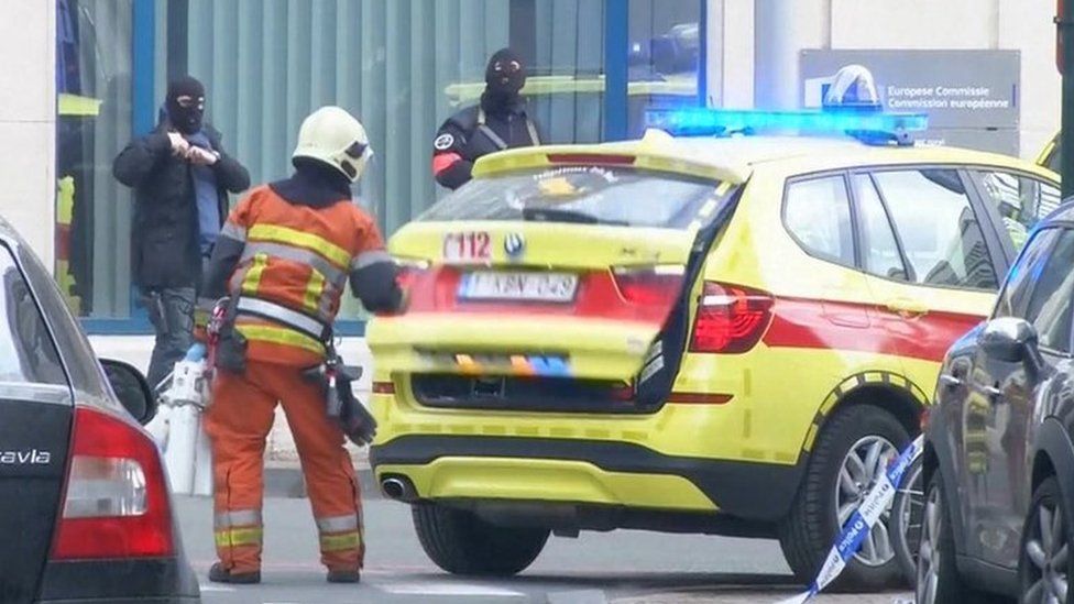 Emergency personnel are seen at the scene of a blast outside a metro station in Brussels, in this still image taken from video on March 22, 2016