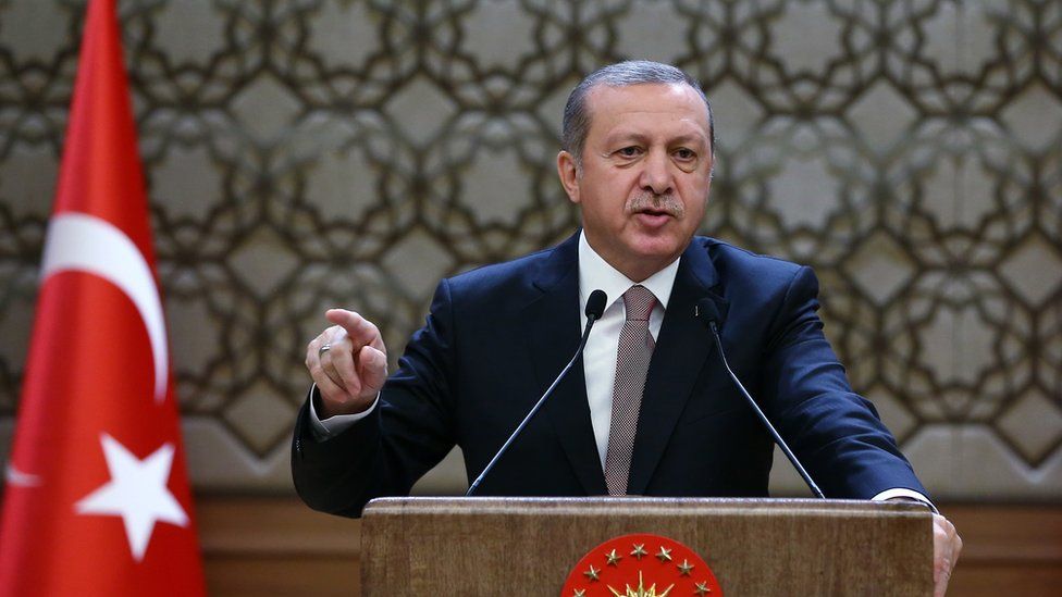 Turkish President Recep Tayyip Erdogan addresses a meeting of local administrators at his palace in Ankara, Turkey, Thursday, Nov. 26, 2015.
